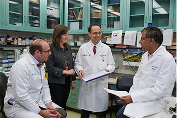 BIDMC OBGYN researchers talking in laboratory