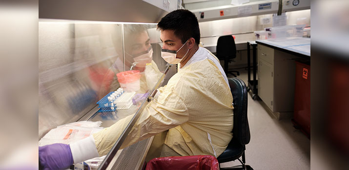 BIDMC clinician working on COVID testing in the lab