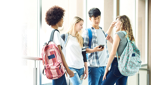 Group of adolescents in a school hallway